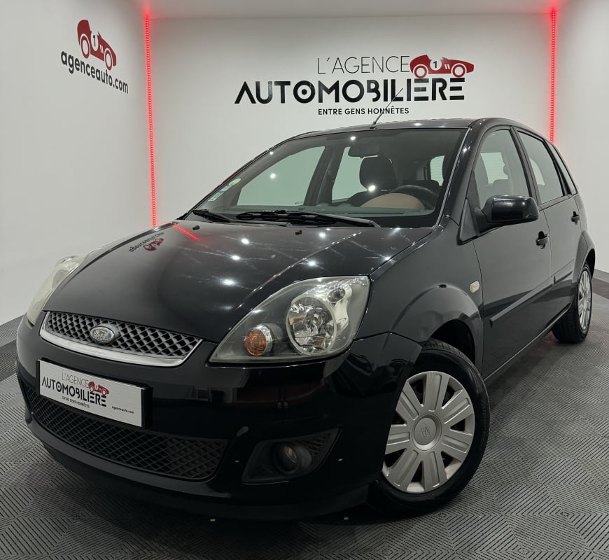 Ford Fiesta FIESTA 1.2 75CV BVM5 5 PORTES CLIM AUTO/AUTO RADIO CD/CENTRALISATION DES PORTES/VITRES ELECTRIQUES — 1