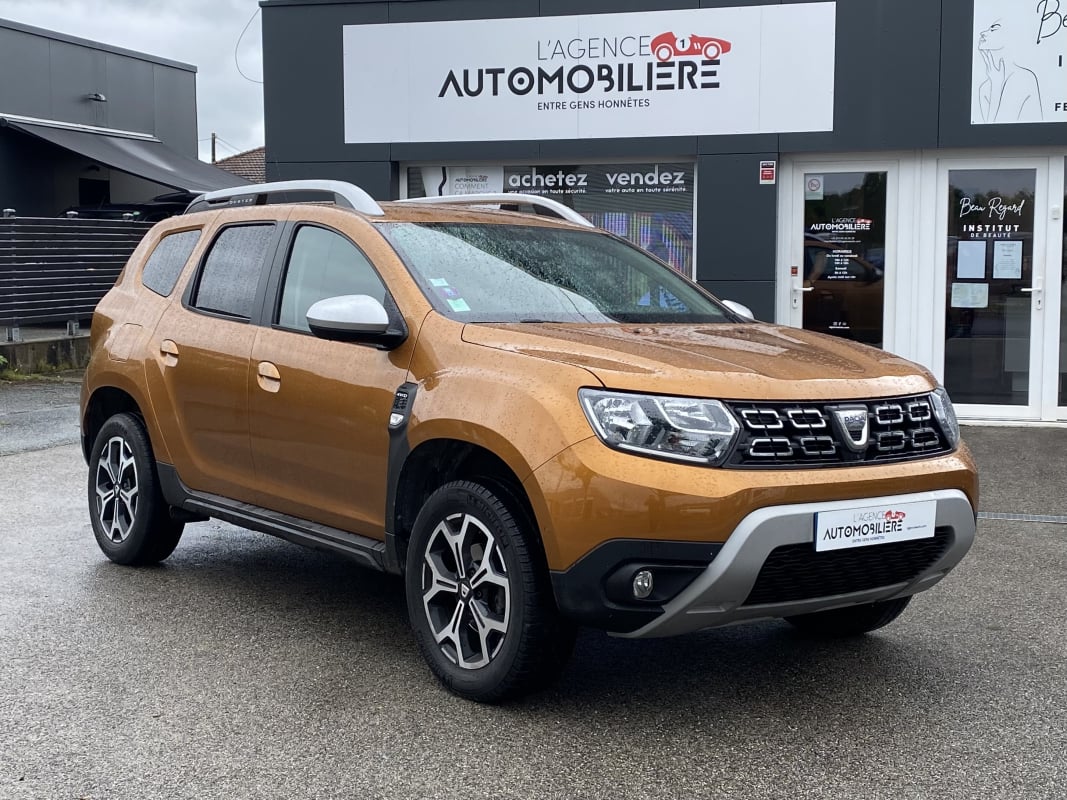 Dacia Duster 1.5 BLUE DCI 115 PRESTIGE 4X4 - CAMERA 360° - ATTELAGE — 1