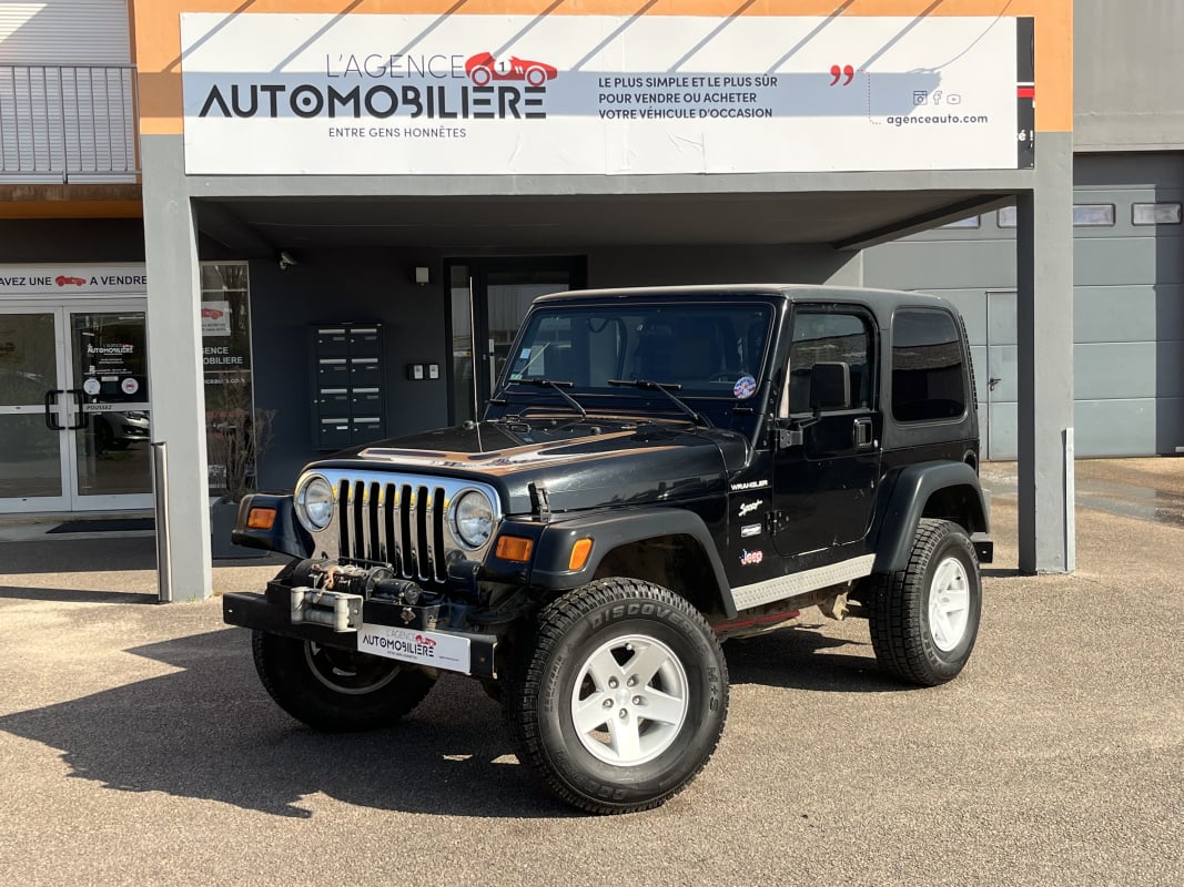 Jeep Wrangler 4.0i 177cv 4WD - Roues tout-terrain/Treuil/Attelage/Hardtop — 1